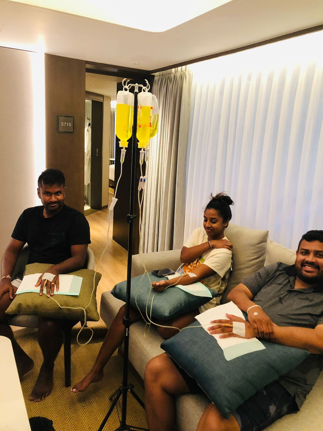Client receiving IV drip at Sanur Bali hotel room early morning